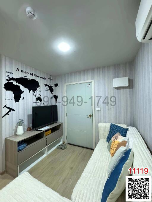 Modern bedroom with world map wall decor and television setup