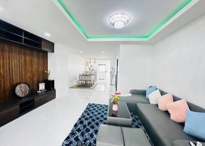 Spacious and modern living room with LED lighting and stylish furnishings