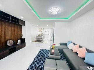 Spacious and modern living room with LED lighting and stylish furnishings