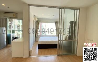 Modern bedroom with sliding glass doors and integrated living area