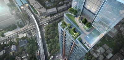 Aerial view of a modern high-rise building with rooftop amenities