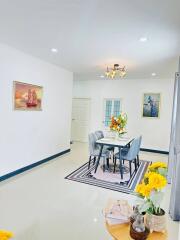 Bright and elegant dining room with a modern table set and vibrant floral decorations