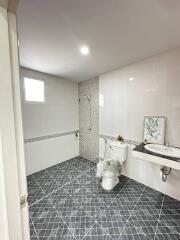 Modern bathroom with white tiles and stylish accents