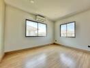 Spacious empty bedroom with ample natural light