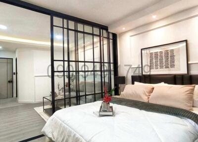 Modern bedroom interior with large bed and glass partition