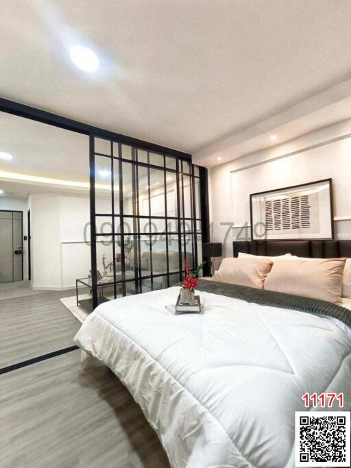 Modern bedroom interior with large bed and glass partition