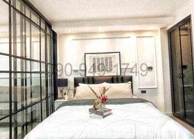 Modern Bedroom with a Large Bed and Glass Partition