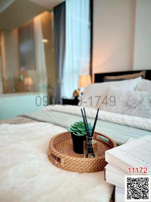 Cozy bedroom interior with a close-up of a bedside table featuring decorative elements