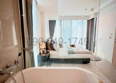 Spacious bedroom with en-suite bathroom and large window