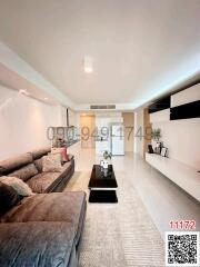 Spacious and modern living room with comfortable seating and elegant decor