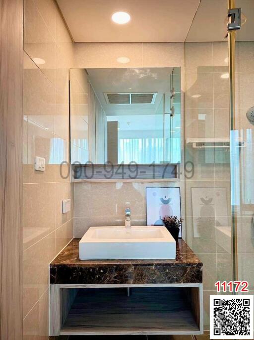 Modern bathroom with a glass shower and marble vanity