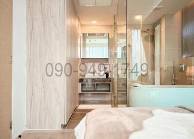 Modern bedroom interior with connected en-suite bathroom