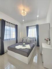 Modern bedroom with stylish furniture and elegant decor