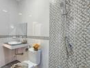 Modern bathroom with mosaic tiles and rain shower