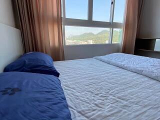 Bright and airy bedroom with a view of the mountains