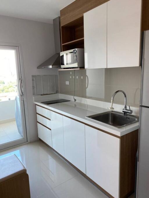 Modern kitchen with stainless steel appliances and white cabinetry