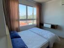 Cozy bedroom with a clear view through the window and ample sunlight