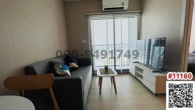 Modern living room with balcony access and natural light