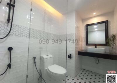 Modern bathroom interior with white hexagonal tiles and contemporary fixtures