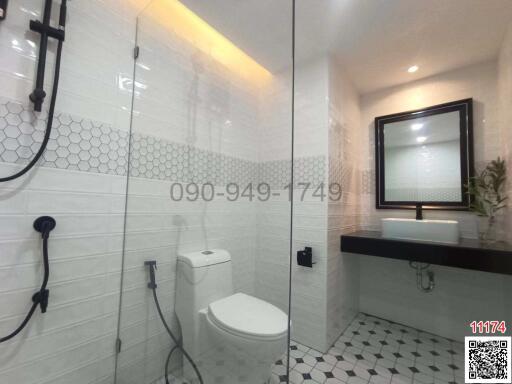 Modern bathroom interior with white hexagonal tiles and contemporary fixtures