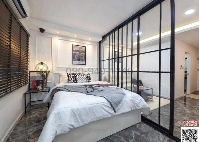 Modern bedroom with glass partition and elegant decor