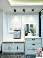 Modern kitchen interior with white cabinetry and marble flooring