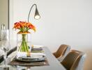 Elegant dining room interior with floral centerpiece and stylish furnishings