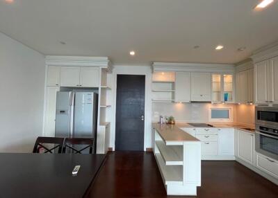 Modern kitchen with white cabinetry and stainless steel appliances