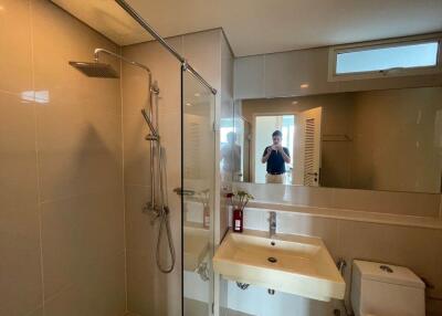 Modern bathroom interior with a glass shower and minimalistic design
