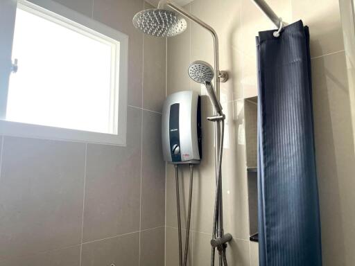 Modern bathroom interior with dual shower heads and natural light