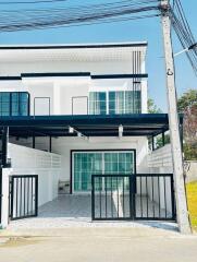 Modern two-storey residential house with balcony and garage