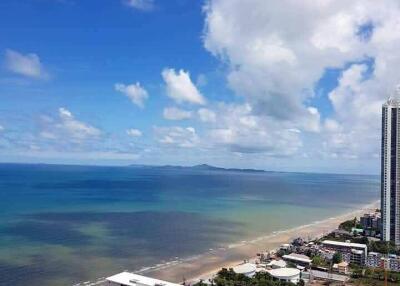 Aerial view of beachfront properties with clear blue skies