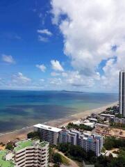 Aerial view of beachfront properties with clear blue skies