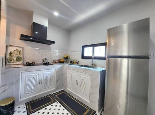 Modern kitchen with stainless steel appliances and white cabinetry