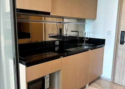 Modern kitchen with wooden cabinets and built-in appliances