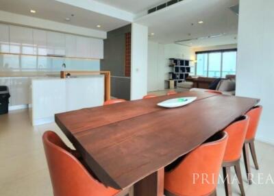 Spacious living room with dining area and open kitchen with modern appliances