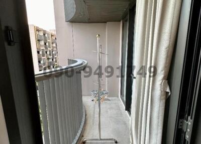 Compact balcony of an apartment with outdoor flooring and city view