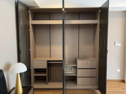 Modern bedroom with built-in wardrobe and wooden flooring