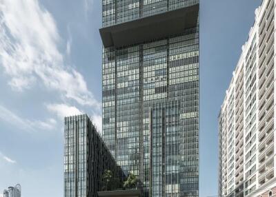 Modern high-rise building exterior with clear skies