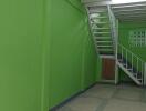 Interior view of a building stairway with green walls