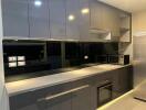 Modern kitchen with integrated appliances and ample cabinetry