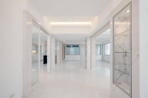 Modern spacious hallway with polished marble floors and elegant detailing