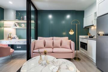 Elegant living room with a pink sofa and modern decor