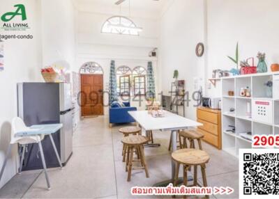 Bright and spacious living room with high ceiling and arched windows