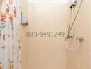 Compact bathroom with shower and printed shower curtain