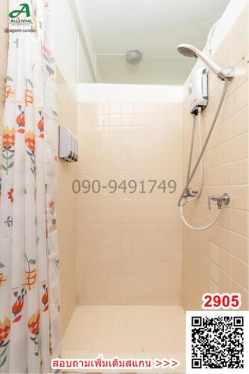 Compact bathroom with shower and printed shower curtain