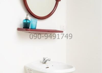 Compact bathroom sink with mirror and shelf