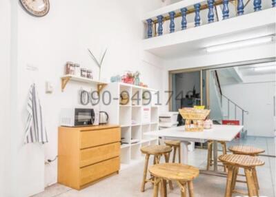 Spacious living room with high ceiling and mezzanine floor