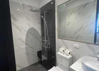 Modern bathroom with walk-in shower and elegant fixtures