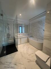 Elegant bathroom with marble finishes and modern fixtures